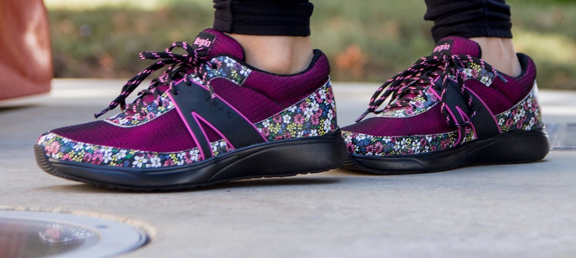 Purple athletic shoes with a floral print
